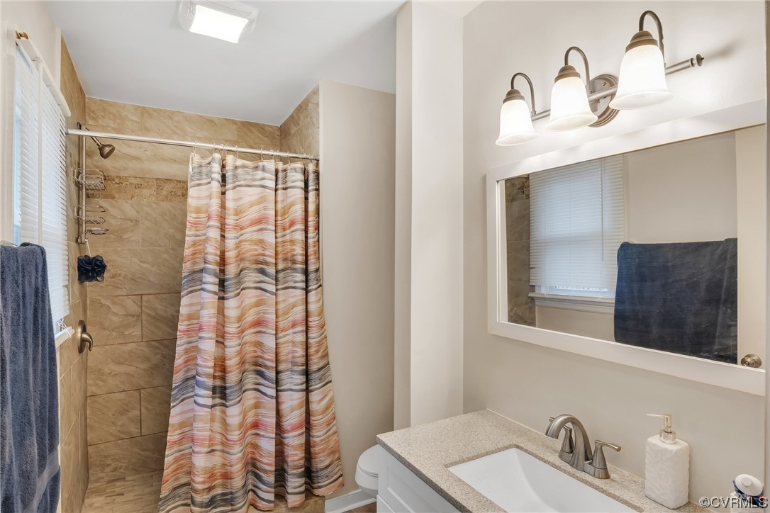 4211 Bridgewood Road Midlothian, VA 23112 - Photo 12 of 27 a bathroom with a sink vanity granite and a mirror