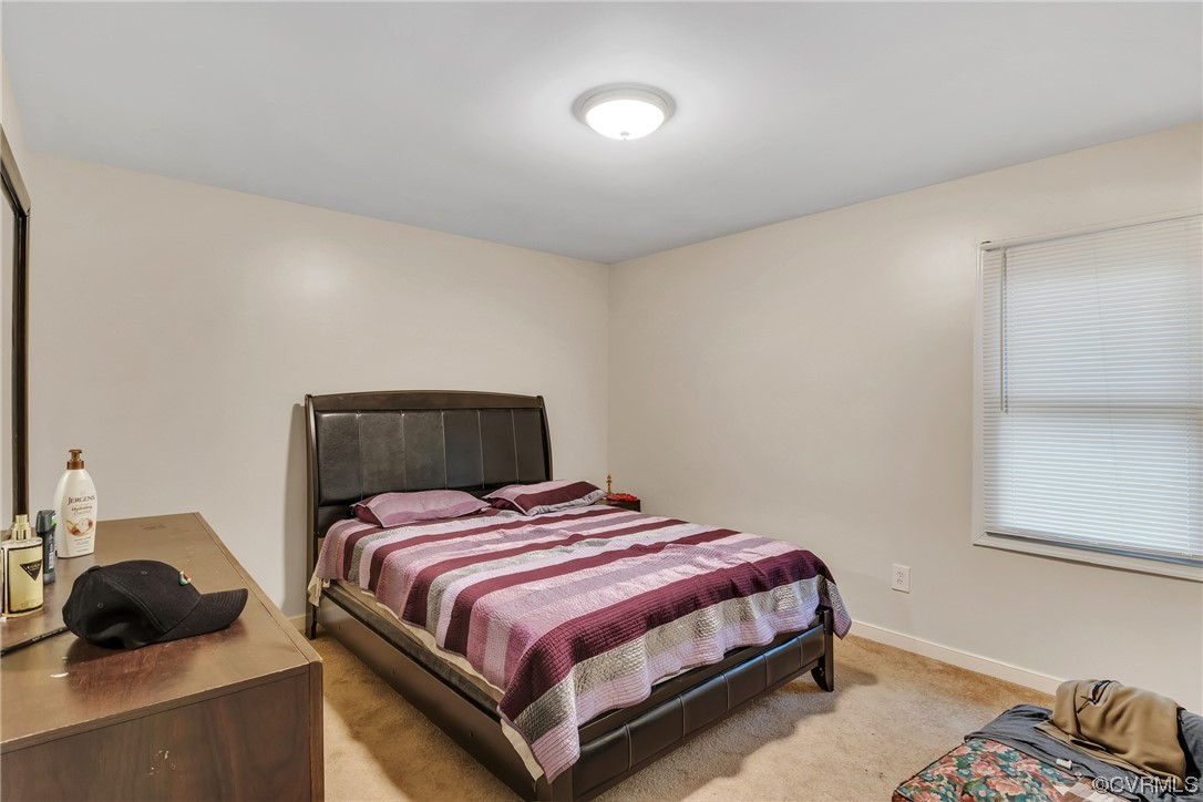 4211 Bridgewood Road Midlothian, VA 23112 - Photo 17 of 27 a bedroom with a bed and a window