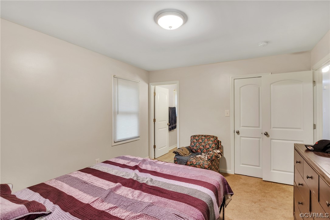 4211 Bridgewood Road Midlothian, VA 23112 - Photo 18 of 27 a bedroom with a bed and a window