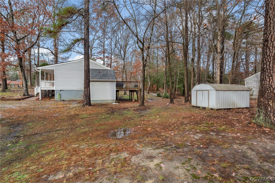 4211 Bridgewood Road Midlothian, VA 23112 - Photo 26 of 27 a backyard of a house with oven and a tree