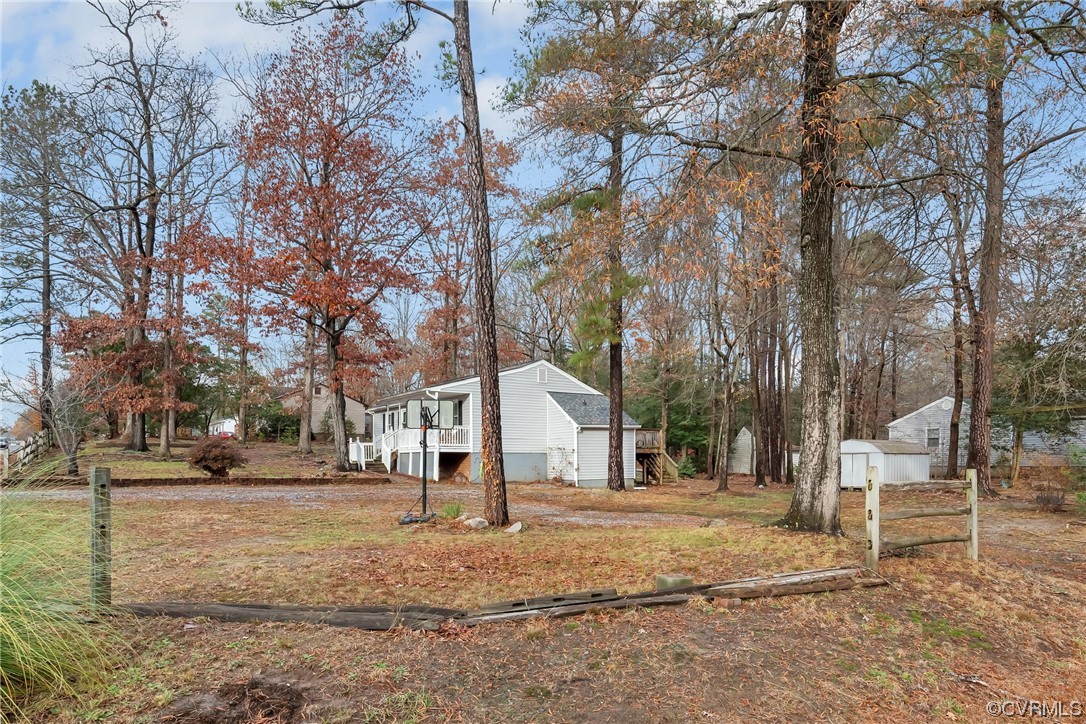 4211 Bridgewood Road Midlothian, VA 23112 - Photo 27 of 27 a view of a white house with a yard covered with snow