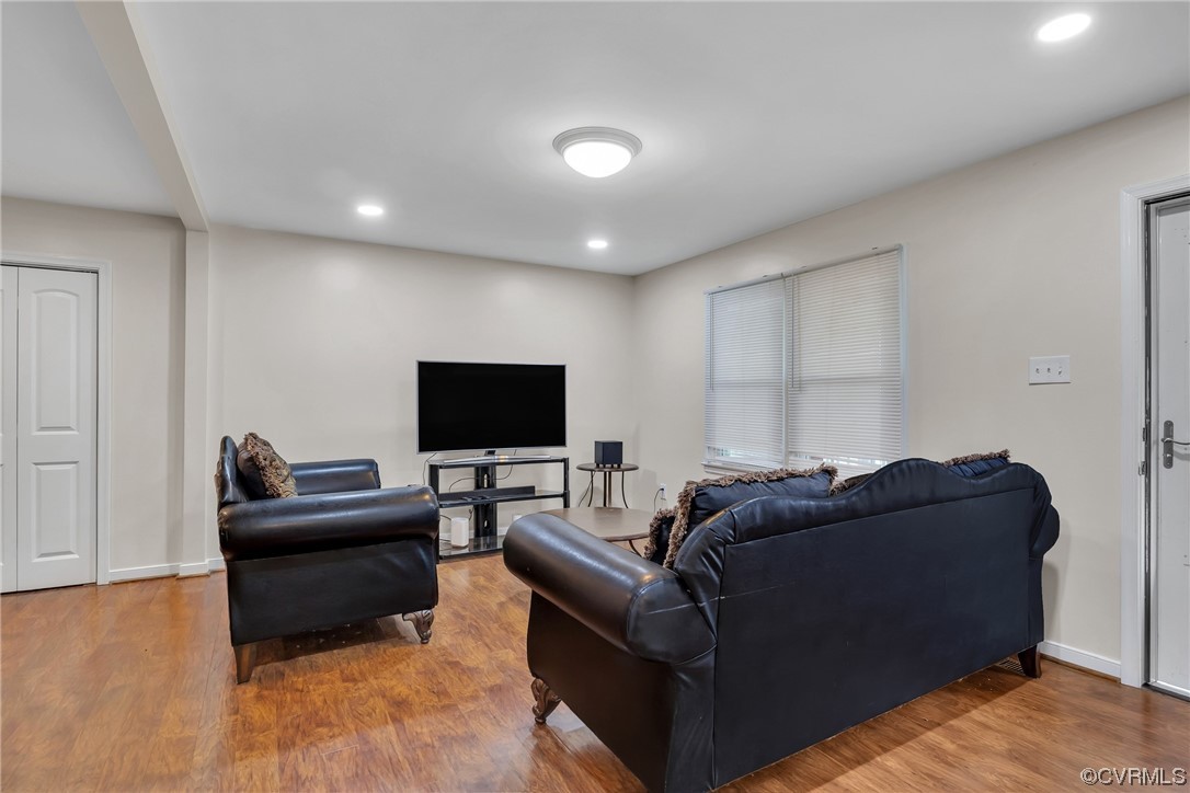4211 Bridgewood Road Midlothian, VA 23112 - Photo 6 of 27 a living room with furniture and a flat screen tv