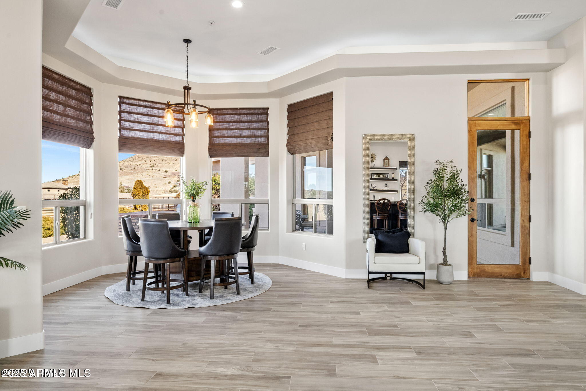 4140 Chuckwalla Road Prescott, AZ 86305 - Photo 13 of 77 a view of a dining room with furniture windows and wooden floor