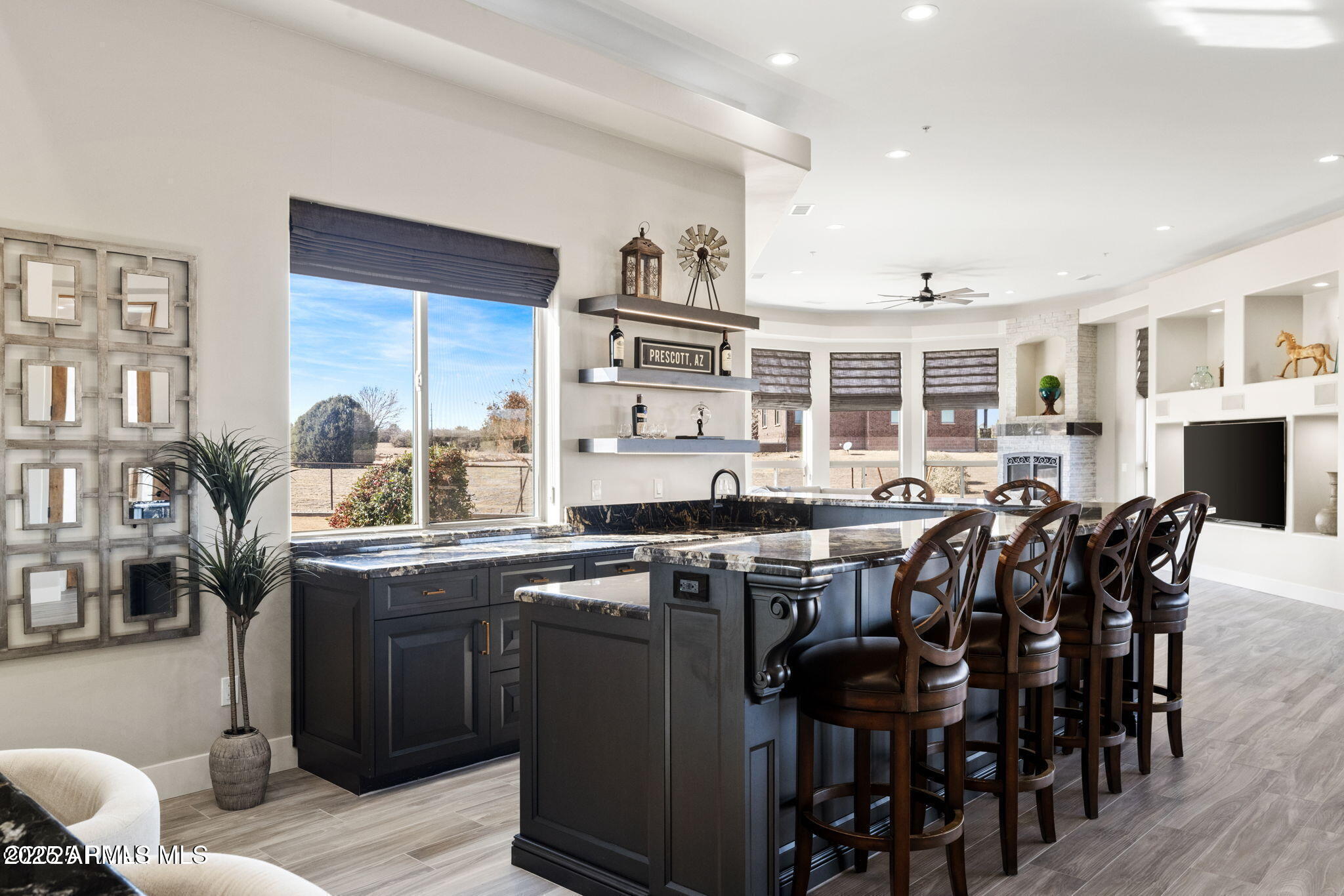 4140 Chuckwalla Road Prescott, AZ 86305 - Photo 17 of 77 a kitchen with lots of wooden cabinets appliances and furniture