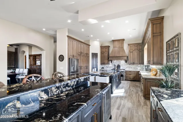 a living room with a fireplace and a large window