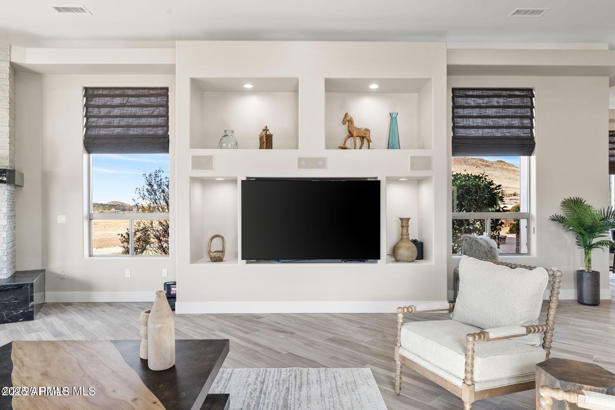 4140 Chuckwalla Road Prescott, AZ 86305 - Photo 22 of 77 a living room with furniture a fireplace and a flat screen tv