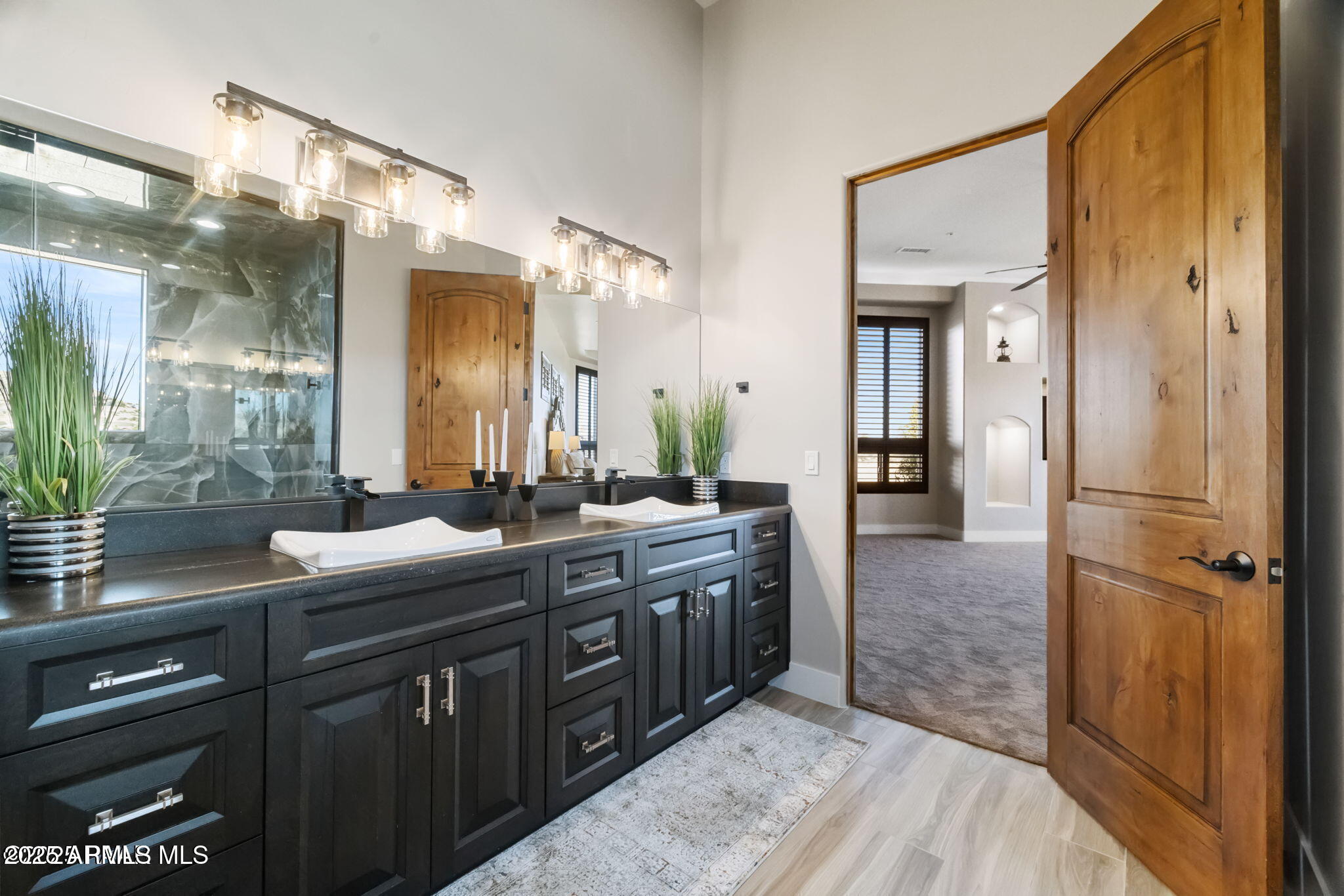 4140 Chuckwalla Road Prescott, AZ 86305 - Photo 34 of 77 a spacious bathroom with a granite countertop sink mirror and shower