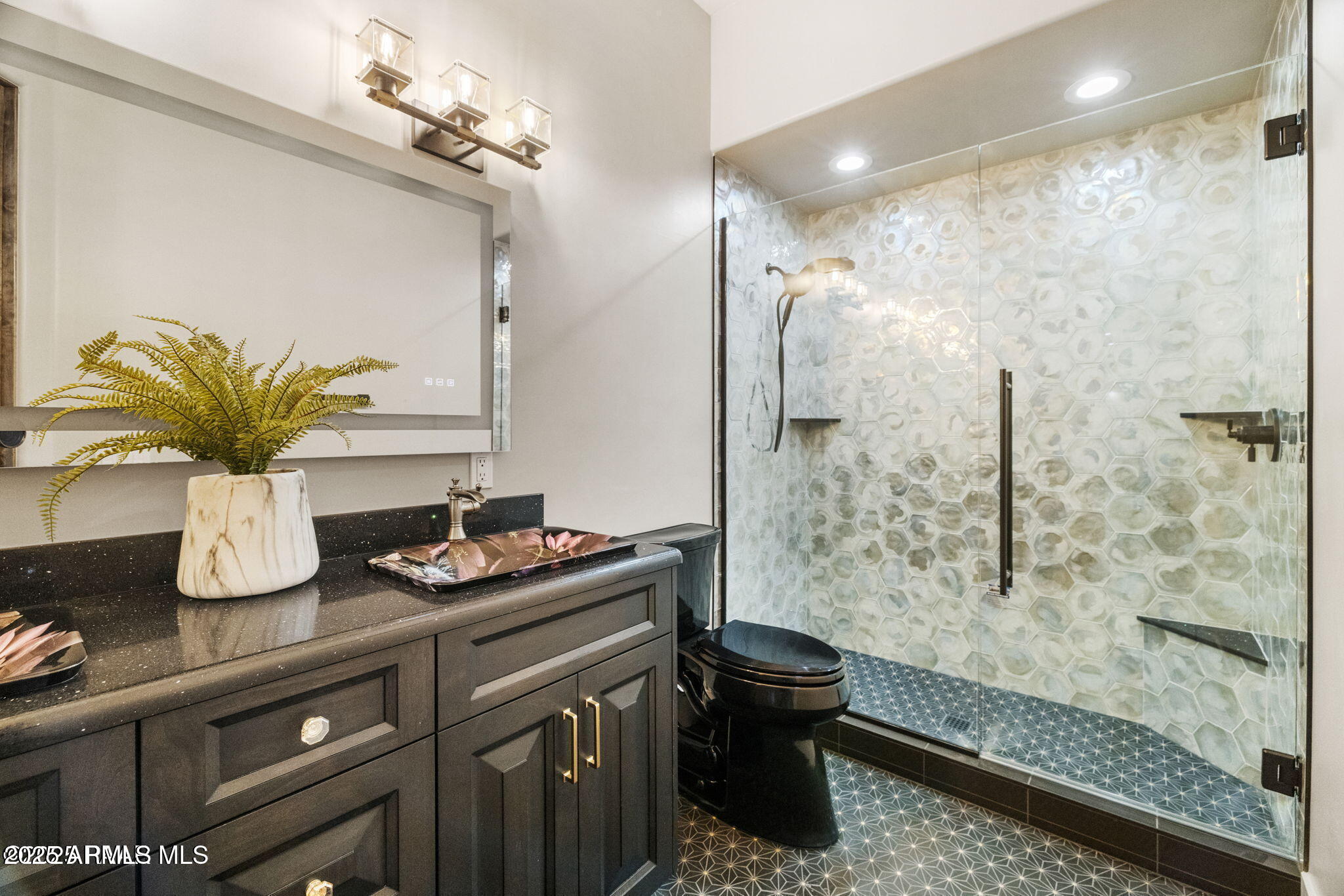 4140 Chuckwalla Road Prescott, AZ 86305 - Photo 38 of 77 a bathroom with a granite countertop sink a mirror and shower