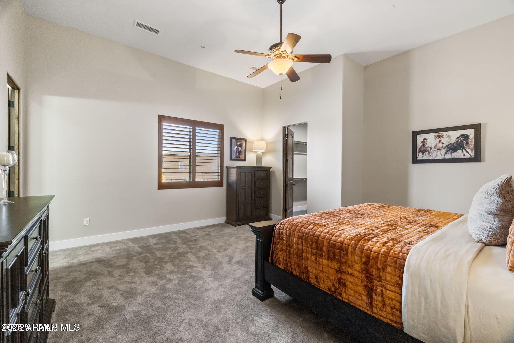 4140 Chuckwalla Road Prescott, AZ 86305 - Photo 41 of 77 a bedroom with a bed and a chandelier