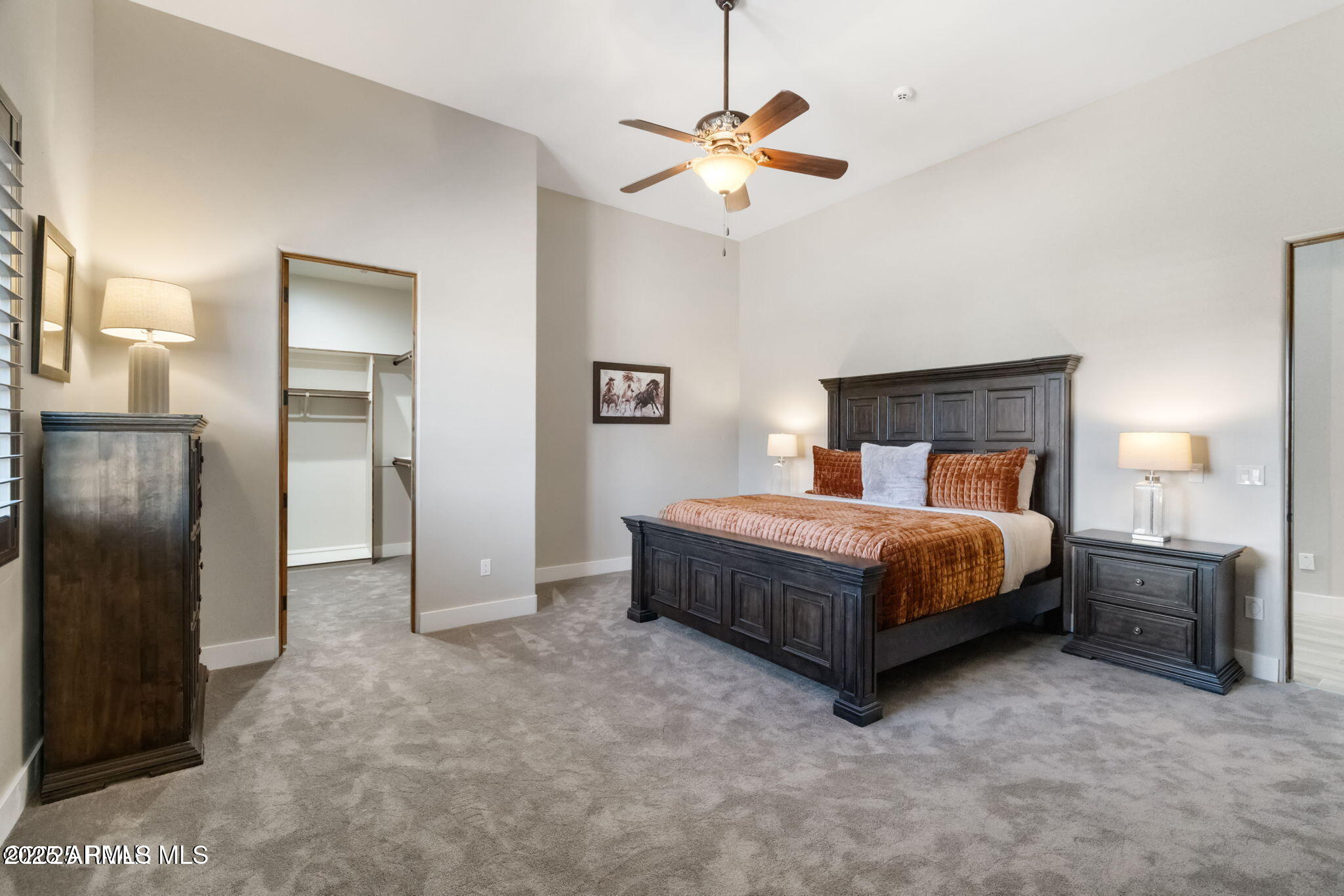 4140 Chuckwalla Road Prescott, AZ 86305 - Photo 42 of 77 a bedroom with a bed and a chandelier