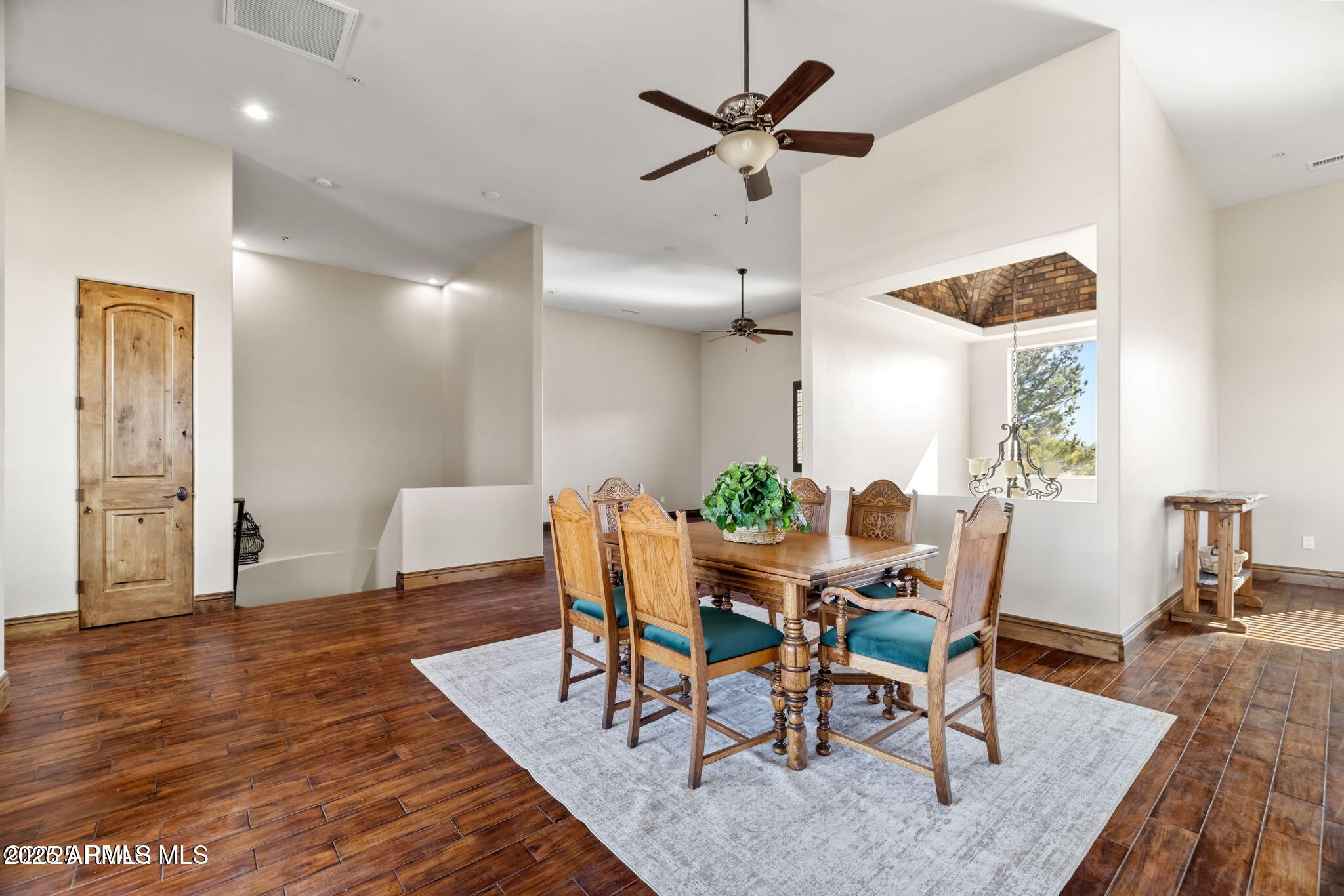 4140 Chuckwalla Road Prescott, AZ 86305 - Photo 54 of 77 a view of a dining room with furniture and wooden floor