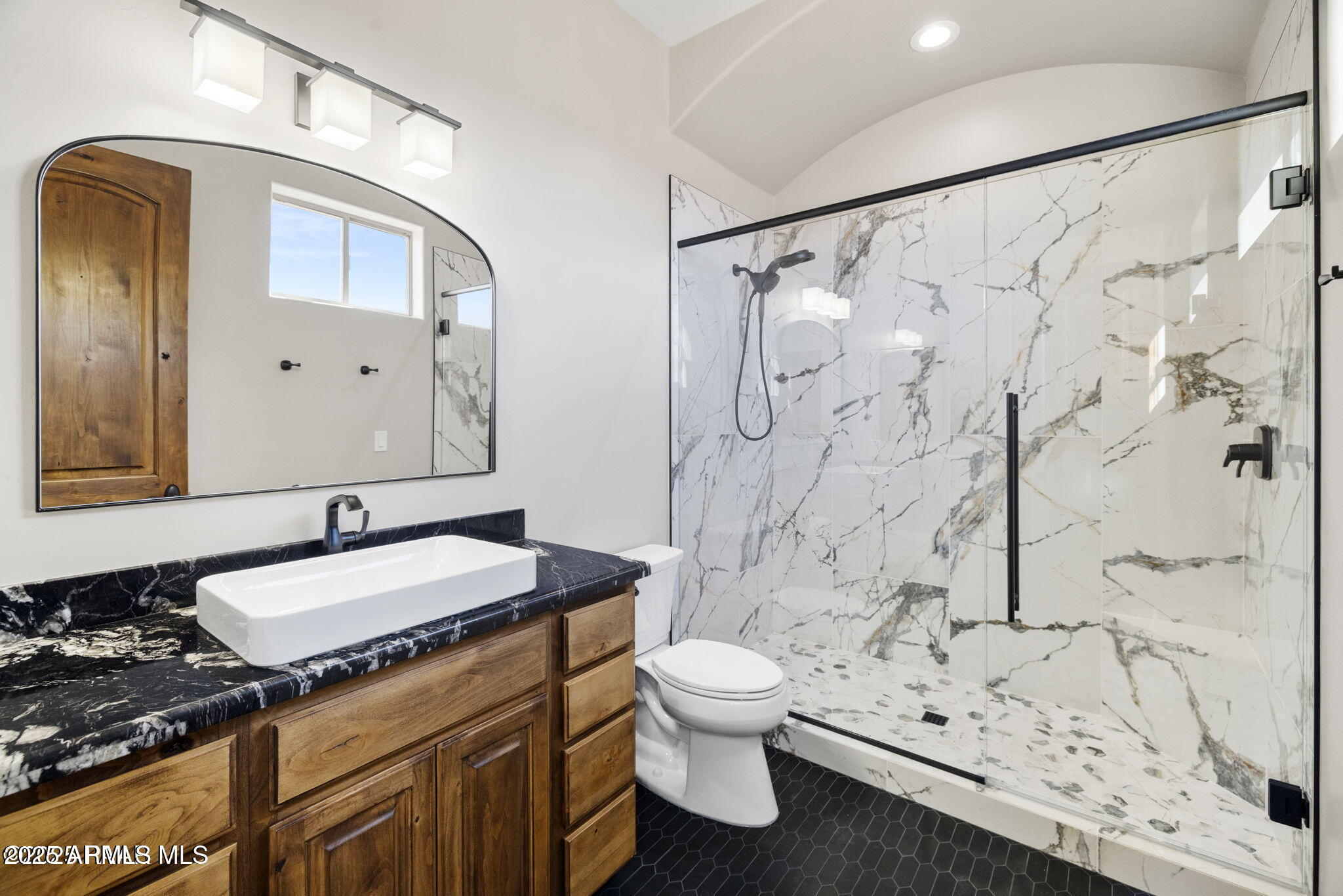 4140 Chuckwalla Road Prescott, AZ 86305 - Photo 62 of 77 a bathroom with a granite countertop sink and a mirror