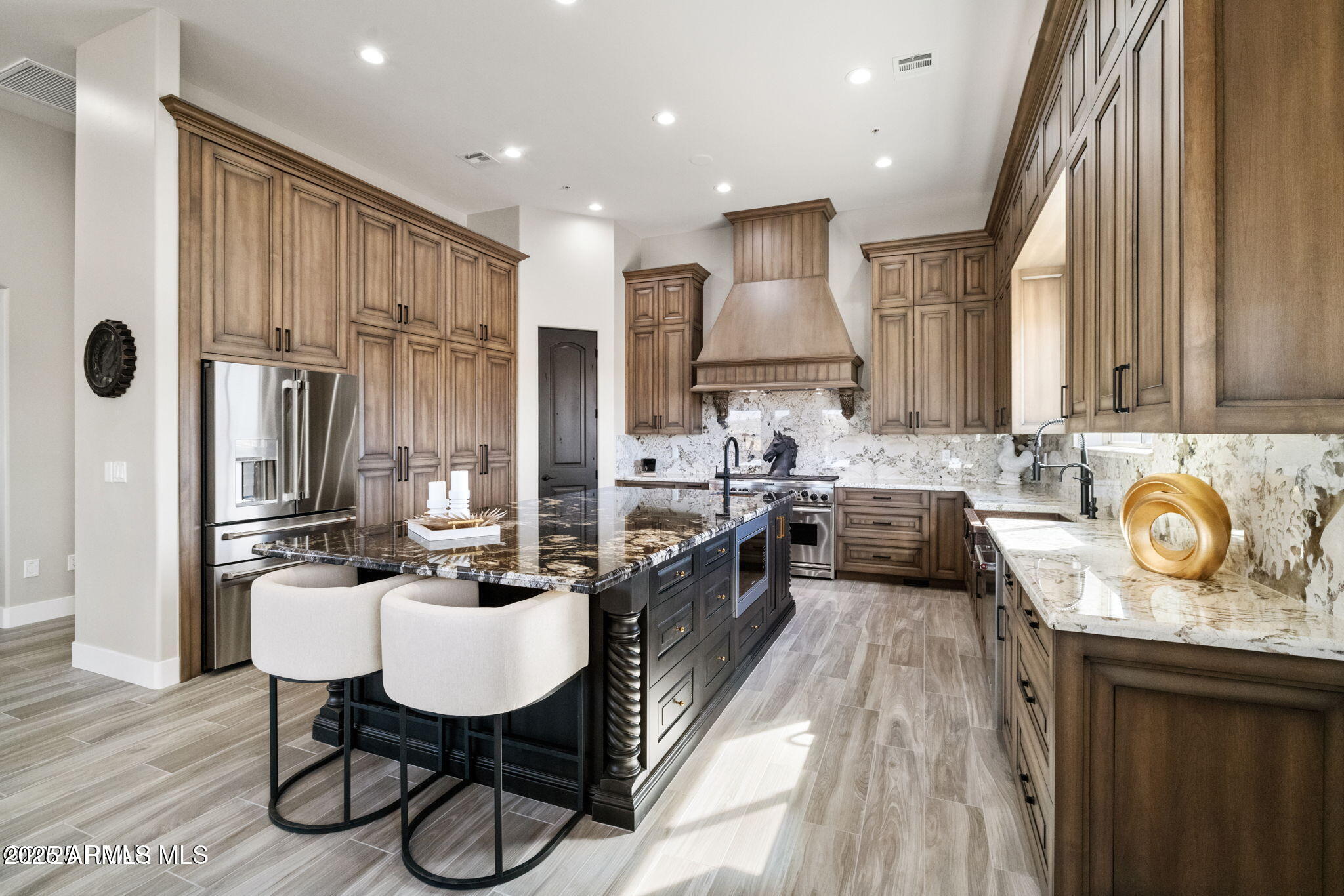 4140 Chuckwalla Road Prescott, AZ 86305 - Photo 9 of 77 a kitchen with kitchen island granite countertop a sink a counter space appliances and cabinets