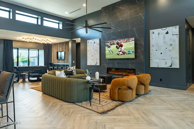a living room with furniture and kitchen view