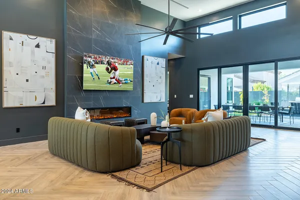 a view of a kitchen with stainless steel appliances granite countertop a living room
