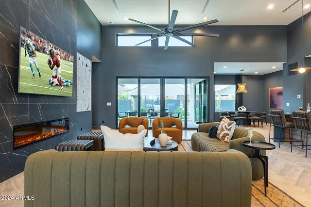 a lamp sitting on a table and chair in a room