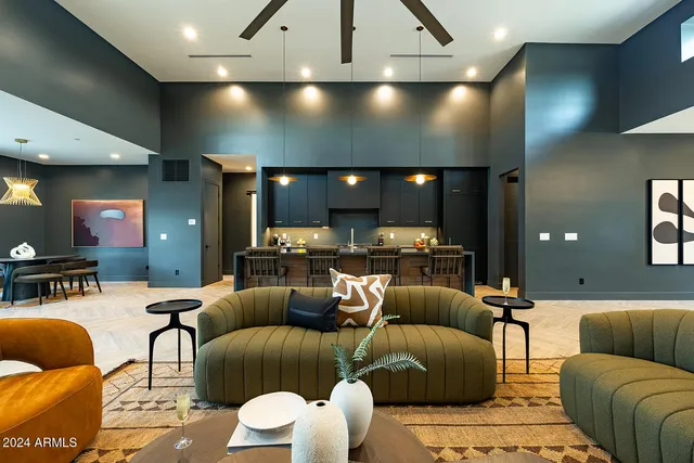 a view of a a dining room with furniture window and wooden floor