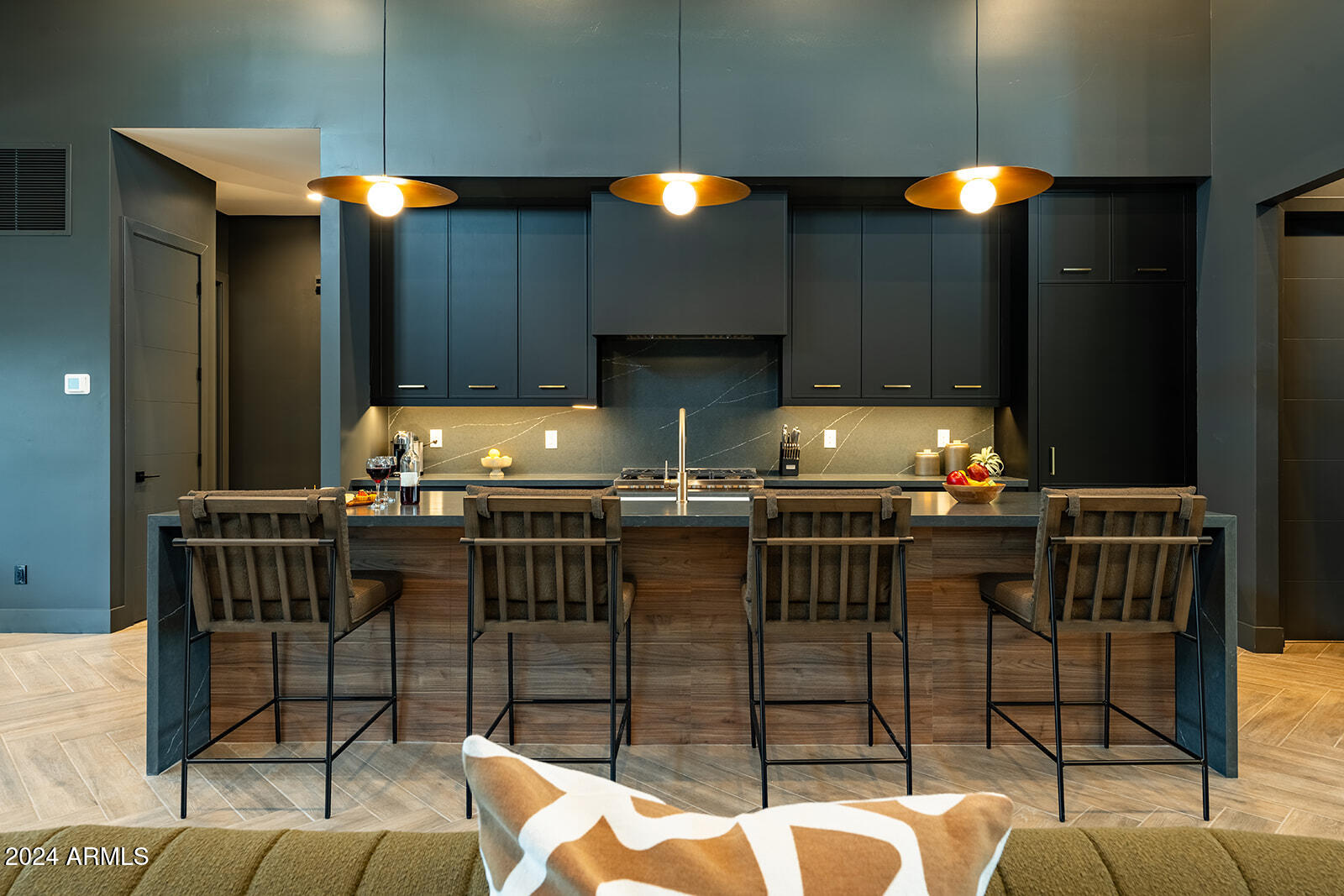 13696 North 88th Place Scottsdale, AZ 85260 - Photo 18 of 60 a kitchen with granite countertop a stove a sink a dining table and chairs