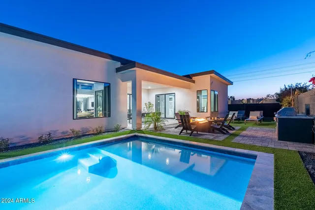 a view of a dining room with furniture and window