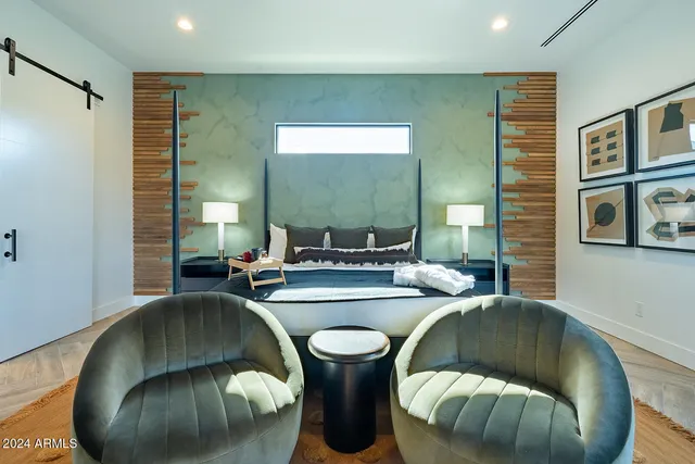 a spacious bathroom with a double vanity sink a mirror and a bathtub