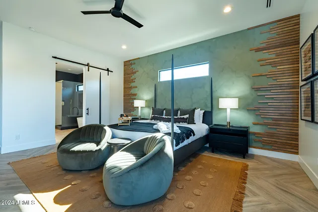 a bedroom with a bed and window