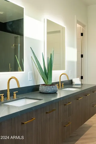 a bedroom with bed and glass door