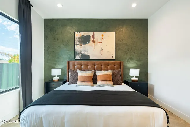 a bedroom with bed and a couch