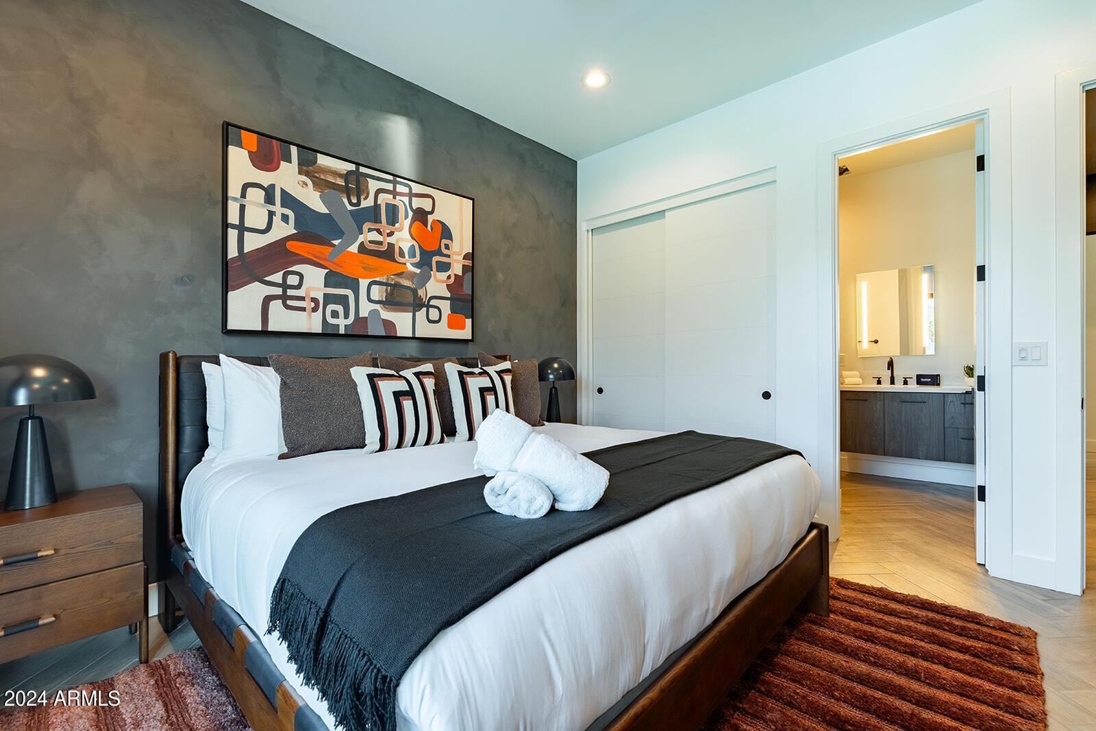 13696 North 88th Place Scottsdale, AZ 85260 - Photo 34 of 60 a bedroom with a bed and glass wall