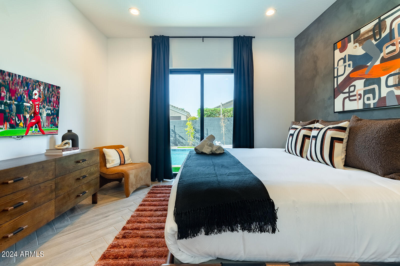 13696 North 88th Place Scottsdale, AZ 85260 - Photo 35 of 60 a bedroom with a bed and a couch