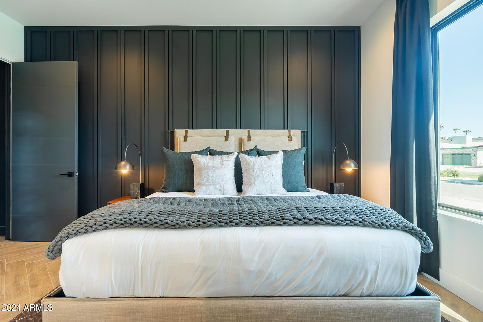 13696 North 88th Place Scottsdale, AZ 85260 - Photo 40 of 60 a bedroom with a bed and wooden floor