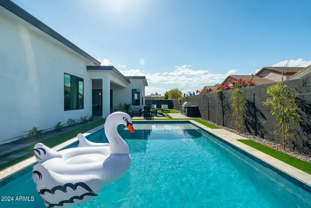 a bedroom with bunk bed and a window