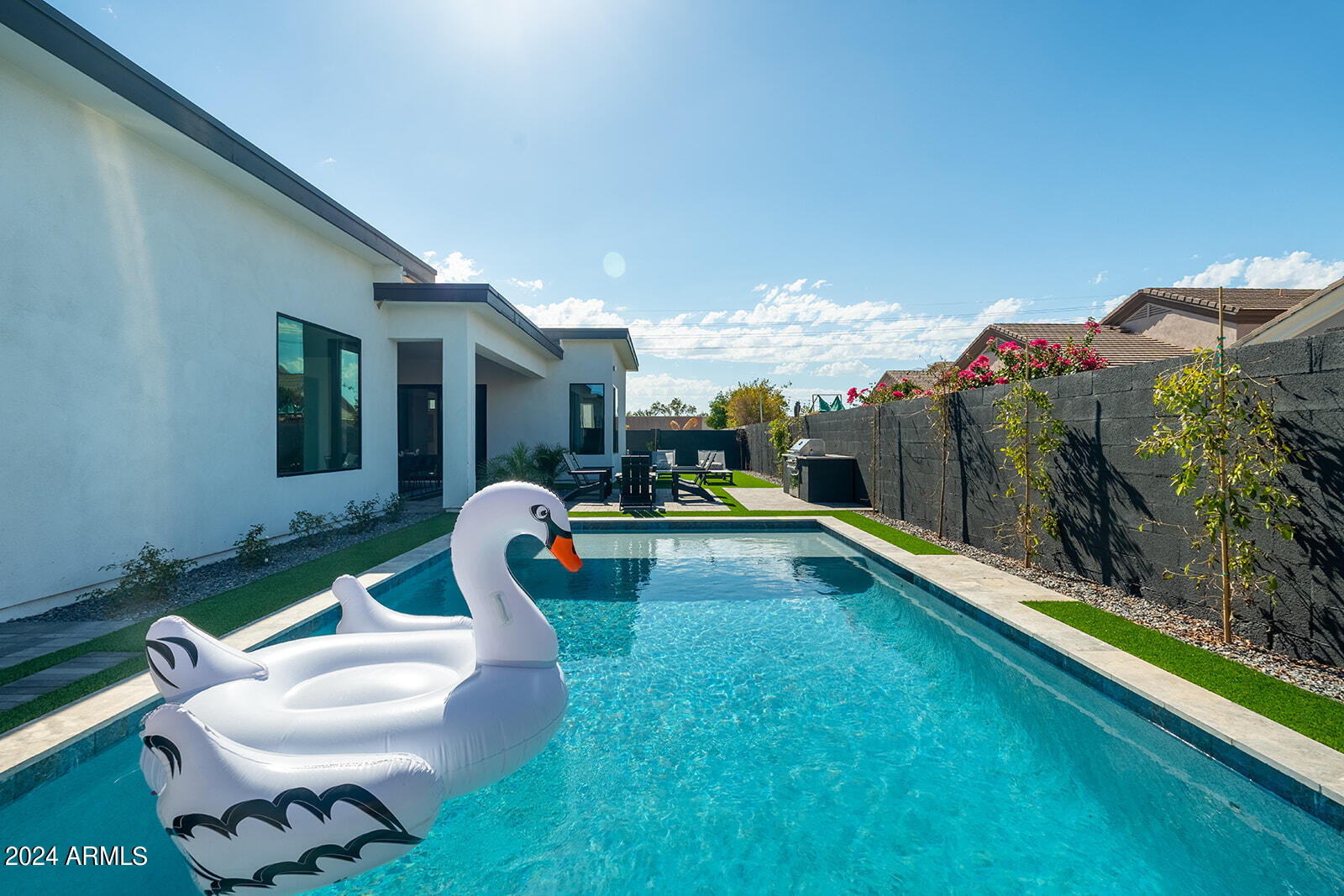 13696 North 88th Place Scottsdale, AZ 85260 - Photo 42 of 60 a living room with furniture rug and a swimming pool