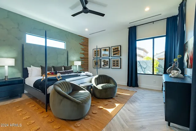 a room with pool table and windows