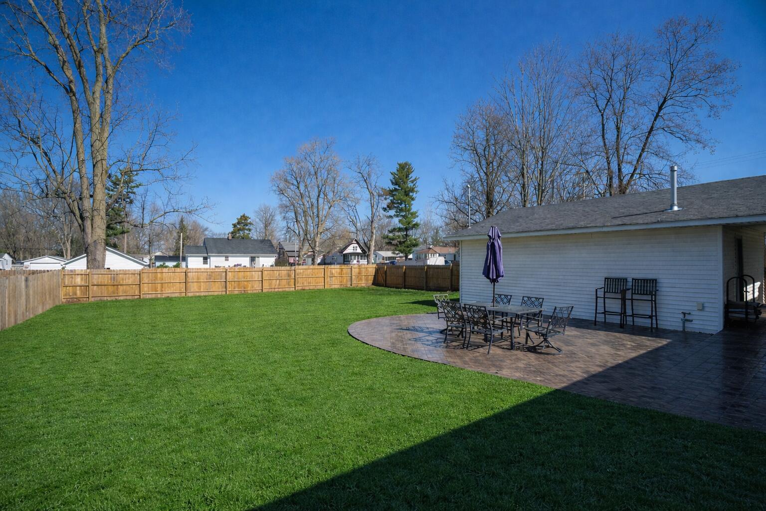 24340 Front Street Mattawan, MI 49071 - Photo 27 of 32 Freshly sealed patio in midday sun