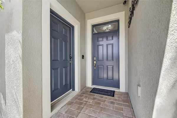 a living room with furniture and kitchen view