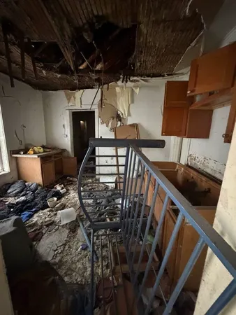 a bathroom with a window and a bath tub