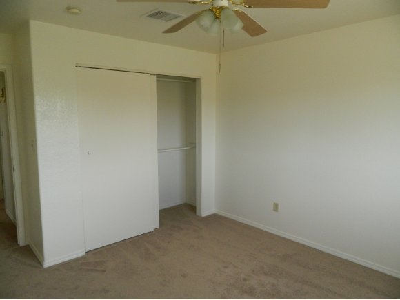 1550 Ranch House Road Paulden, AZ 86334 - Photo 14 of 24 an empty room with a fan