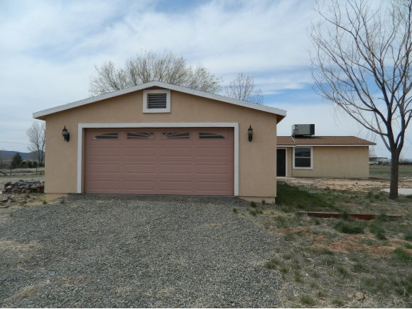 1550 Ranch House Road Paulden, AZ 86334 - Photo 19 of 24 a front view of a house with a yard