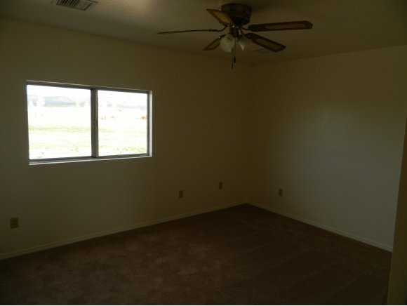 1550 Ranch House Road Paulden, AZ 86334 - Photo 8 of 24 an empty room with a window