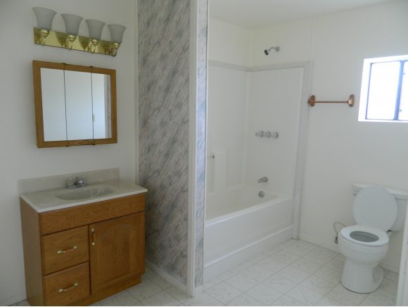 1550 Ranch House Road Paulden, AZ 86334 - Photo 10 of 24 a bathroom with a toilet sink and mirror