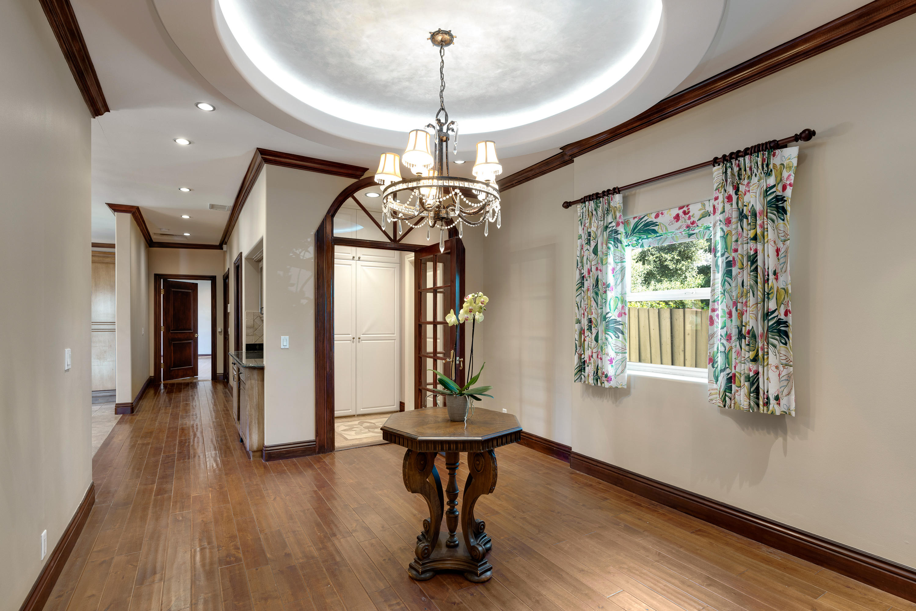 825 Chehalem Road La Canada Flintridge, CA 91011 - Photo 11 of 24 a view of a room with wooden floor chandelier and windows