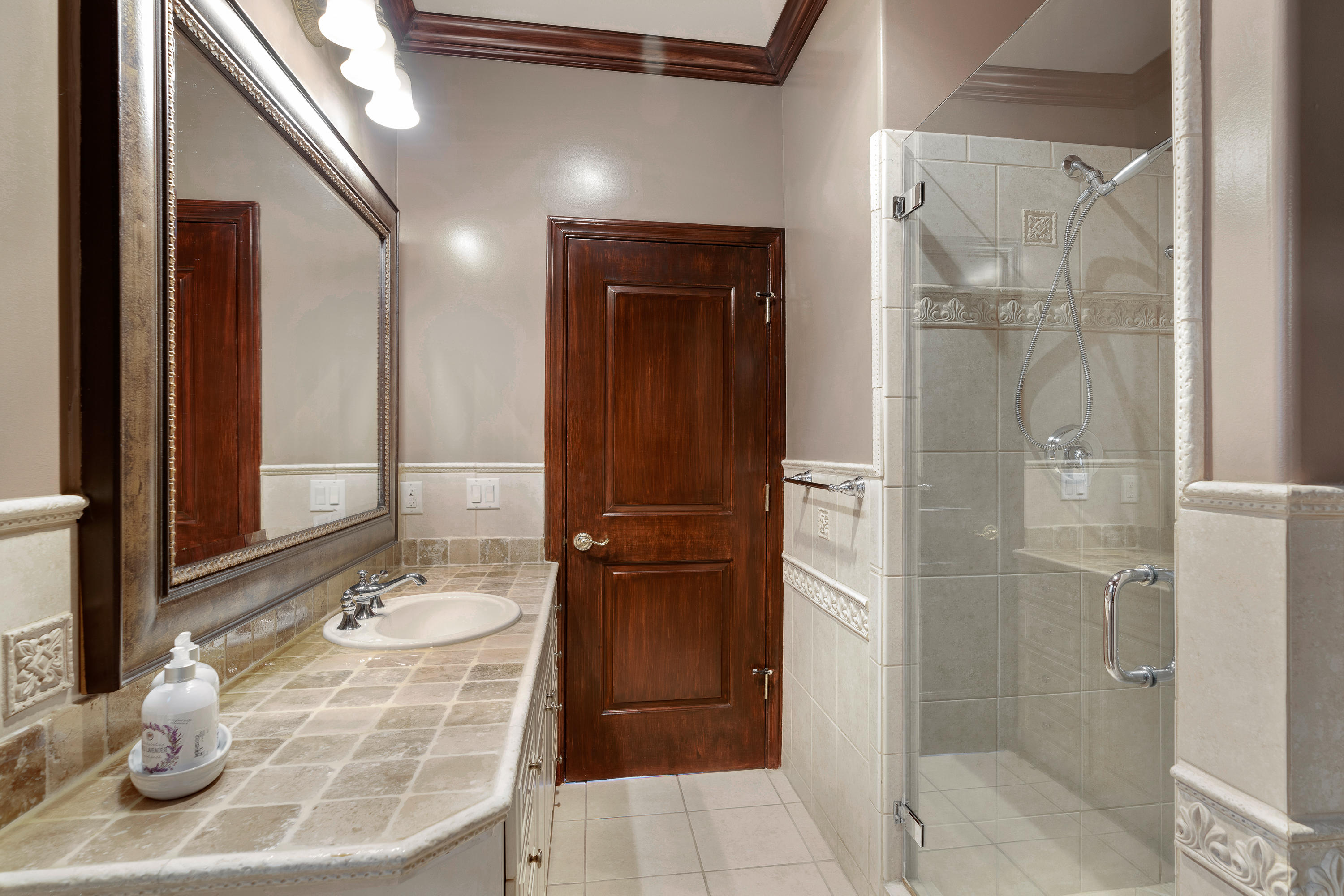 825 Chehalem Road La Canada Flintridge, CA 91011 - Photo 12 of 24 a bathroom with a granite countertop shower mirror and a sink