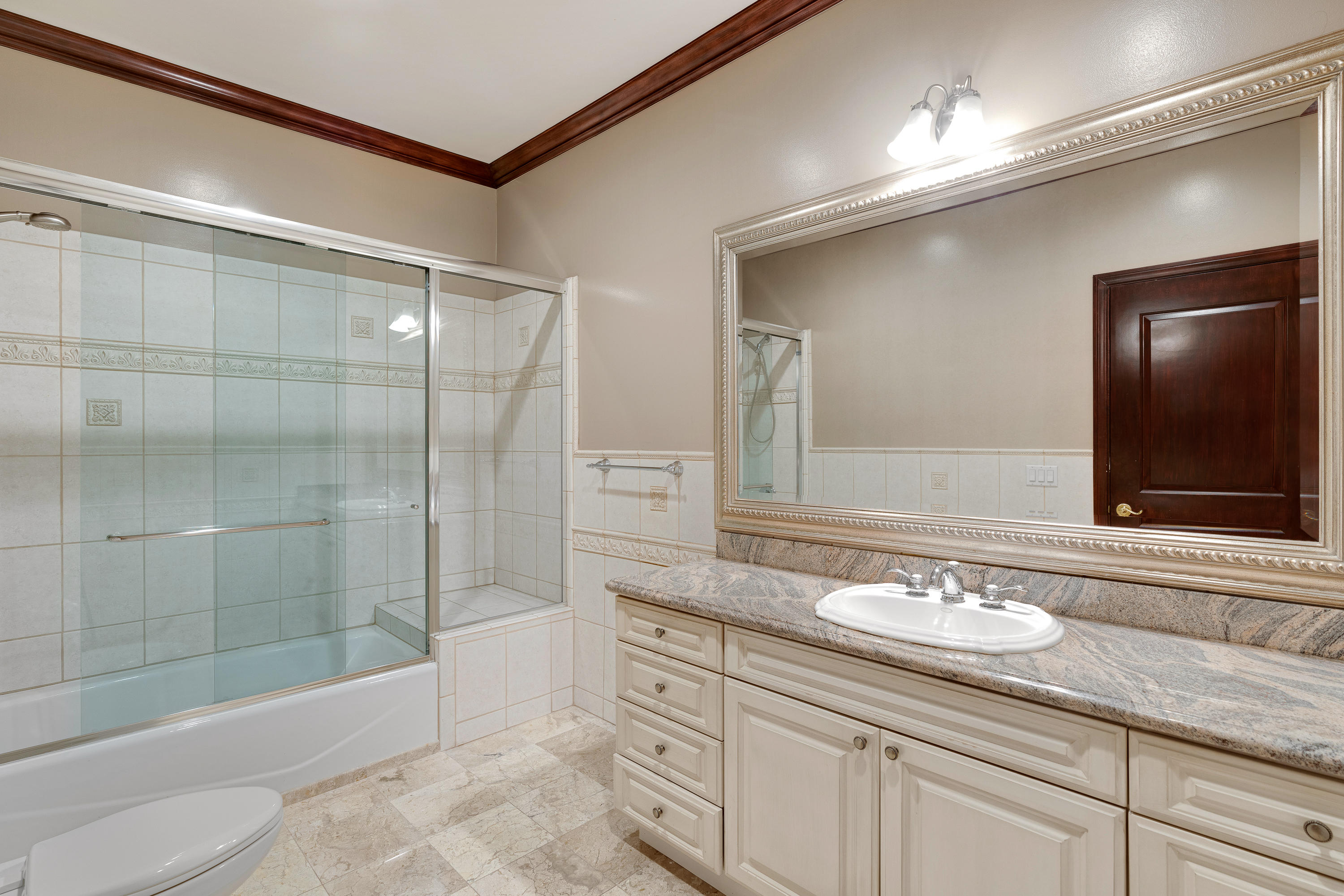825 Chehalem Road La Canada Flintridge, CA 91011 - Photo 14 of 24 a bathroom with a shower sink and mirror