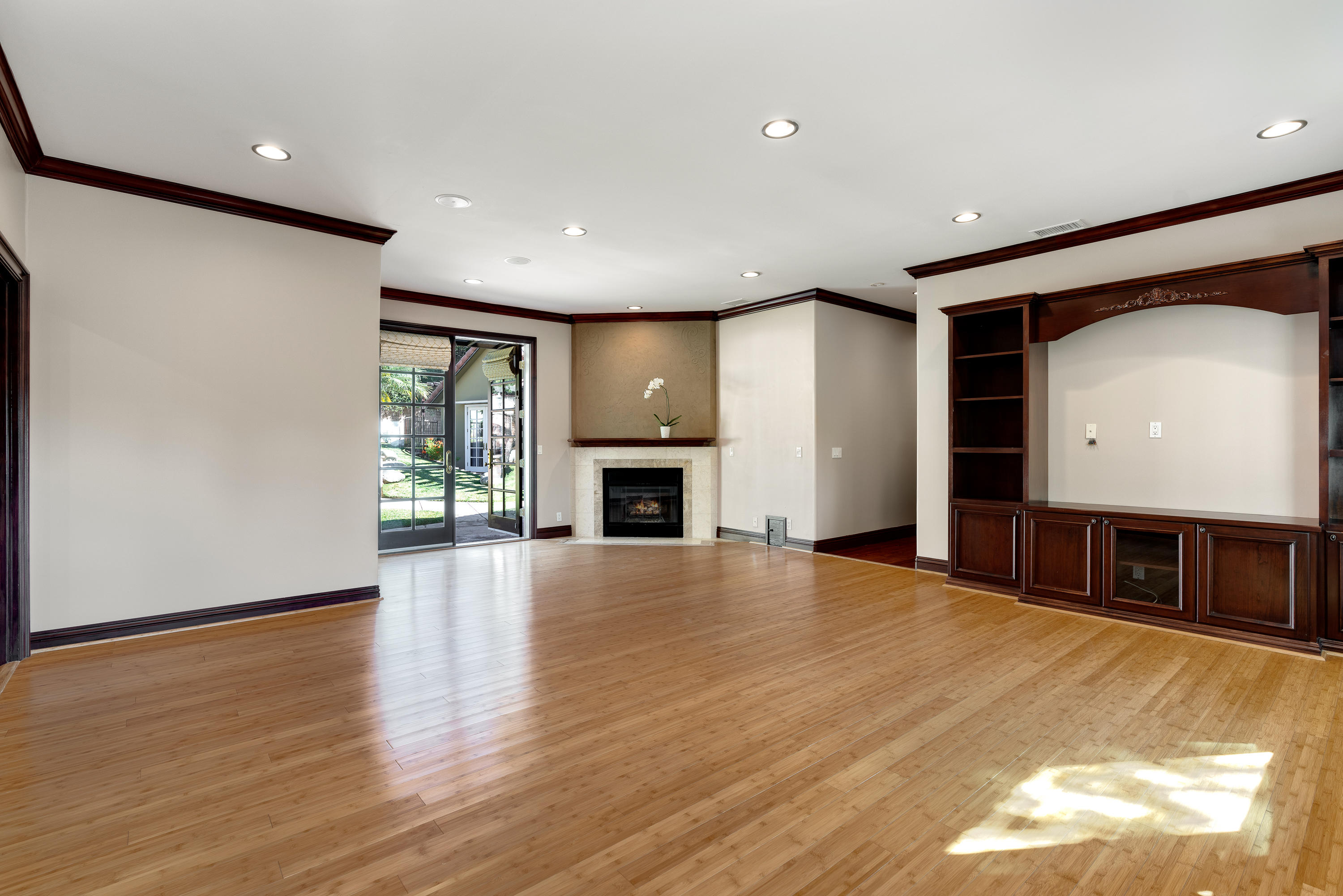 825 Chehalem Road La Canada Flintridge, CA 91011 - Photo 15 of 24 a view of an empty room with a fireplace and a window