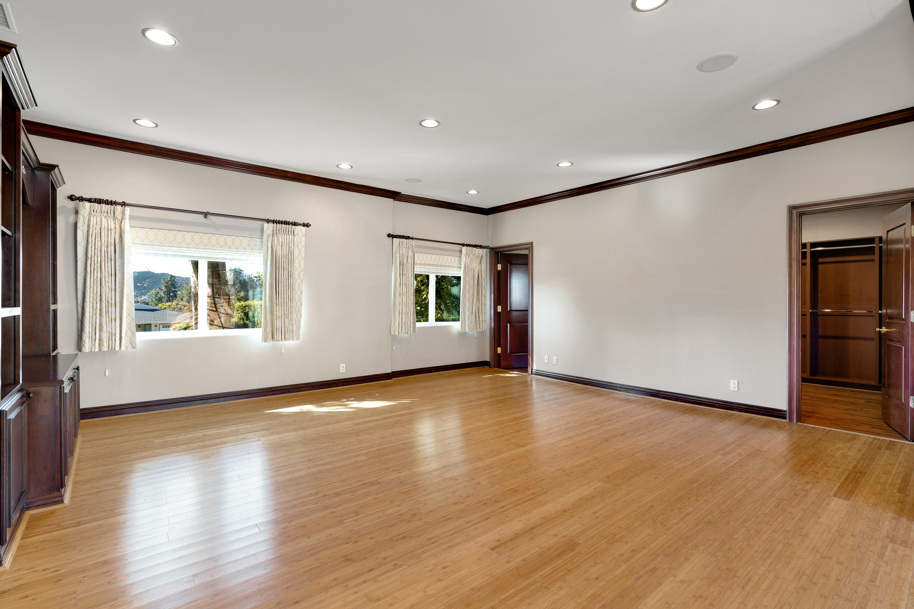 825 Chehalem Road La Canada Flintridge, CA 91011 - Photo 16 of 24 a view of an empty room with wooden floor and a window
