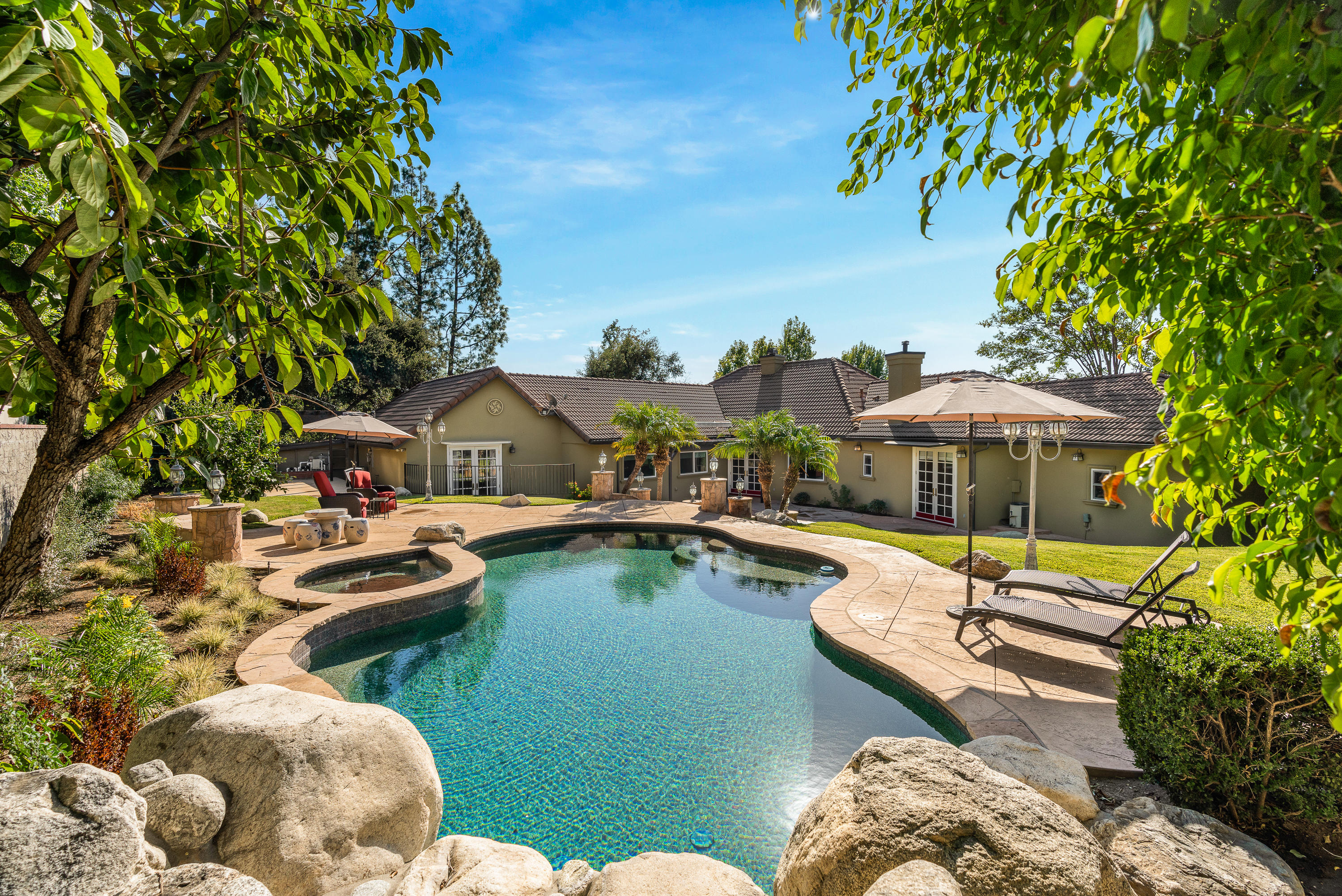 825 Chehalem Road La Canada Flintridge, CA 91011 - Photo 23 of 24 a view of swimming pool with outdoor seating and trees in the background