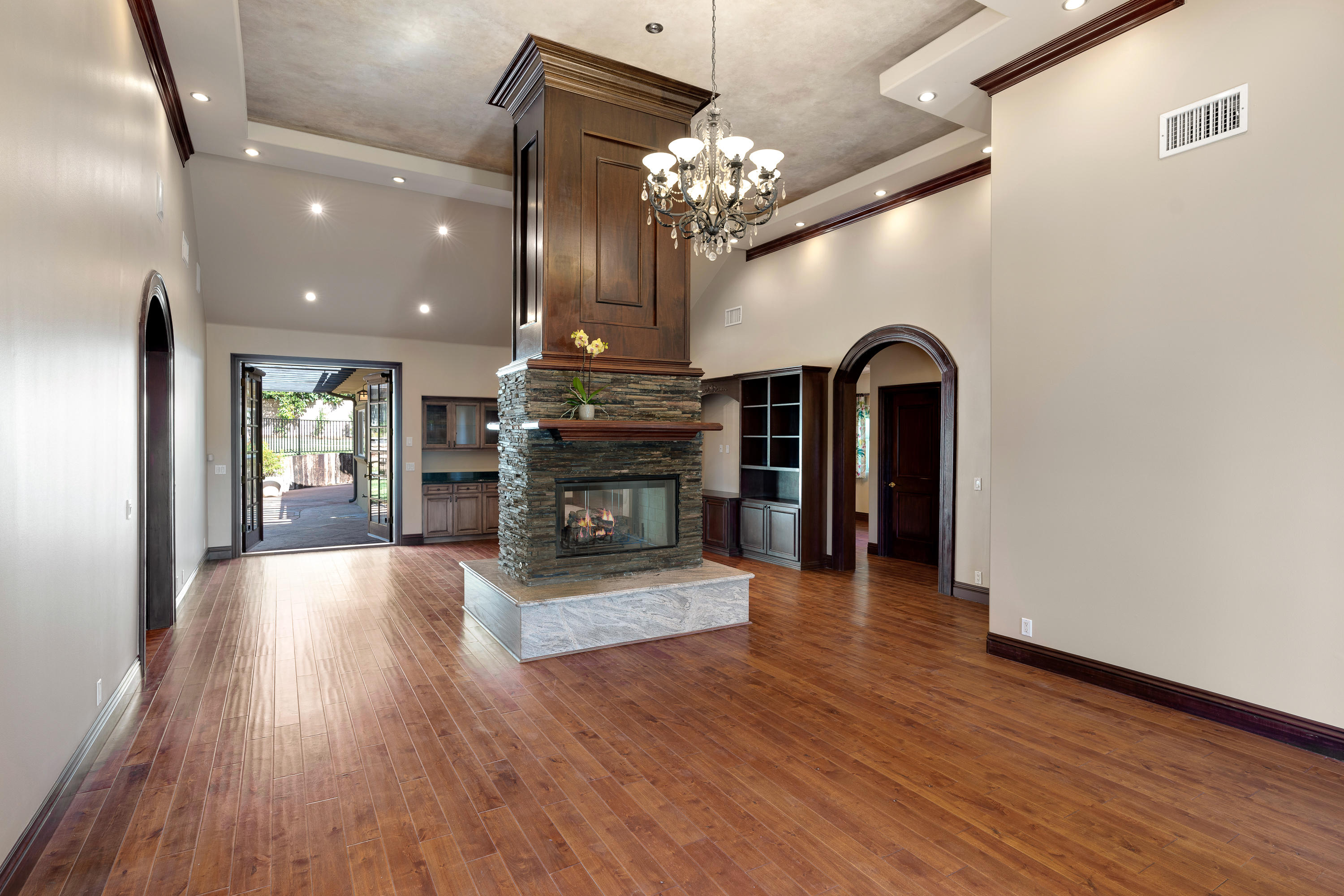 825 Chehalem Road La Canada Flintridge, CA 91011 - Photo 5 of 24 a living room with fireplace furniture and a chandelier