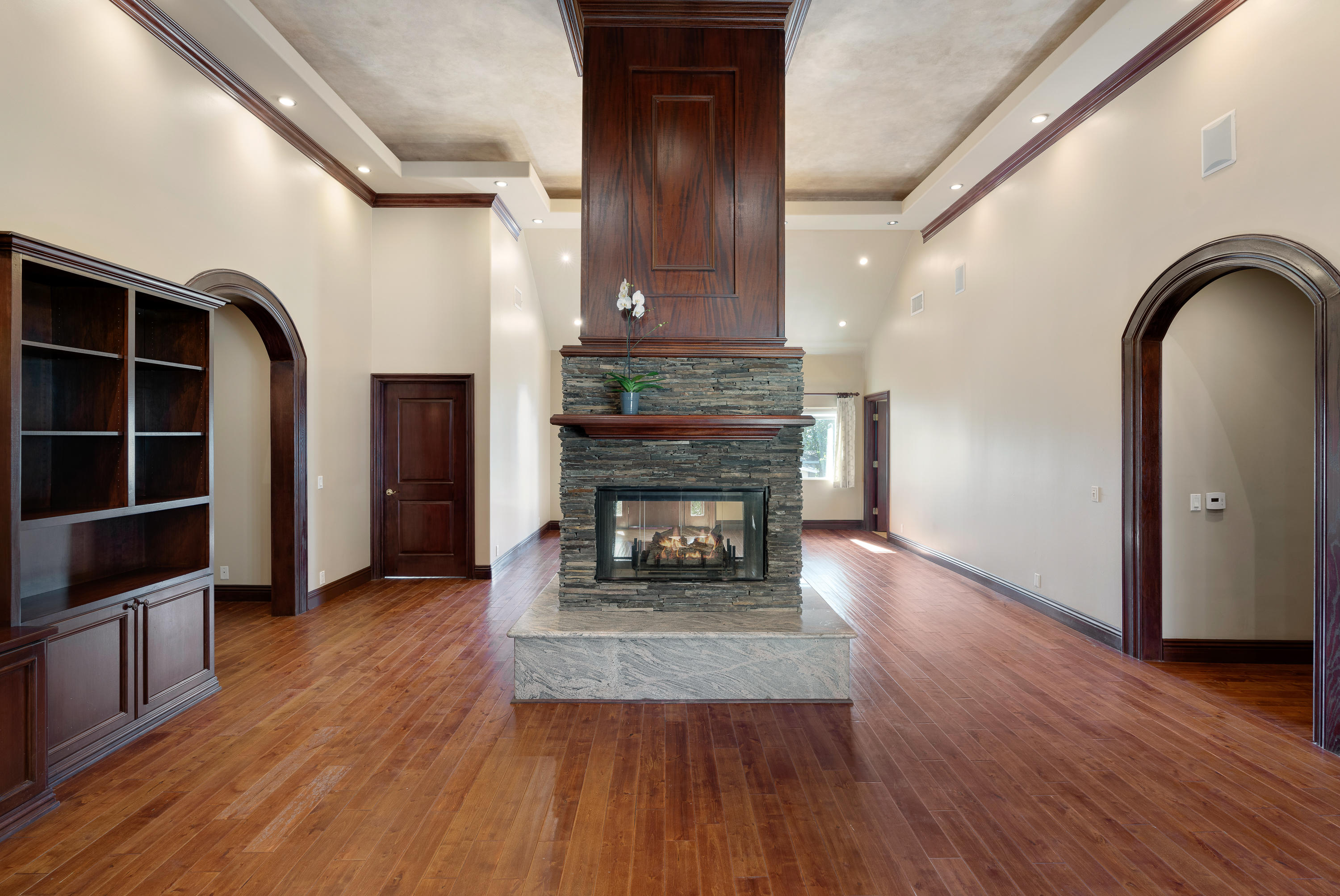 825 Chehalem Road La Canada Flintridge, CA 91011 - Photo 6 of 24 a living room with hard wood floors and a fireplace