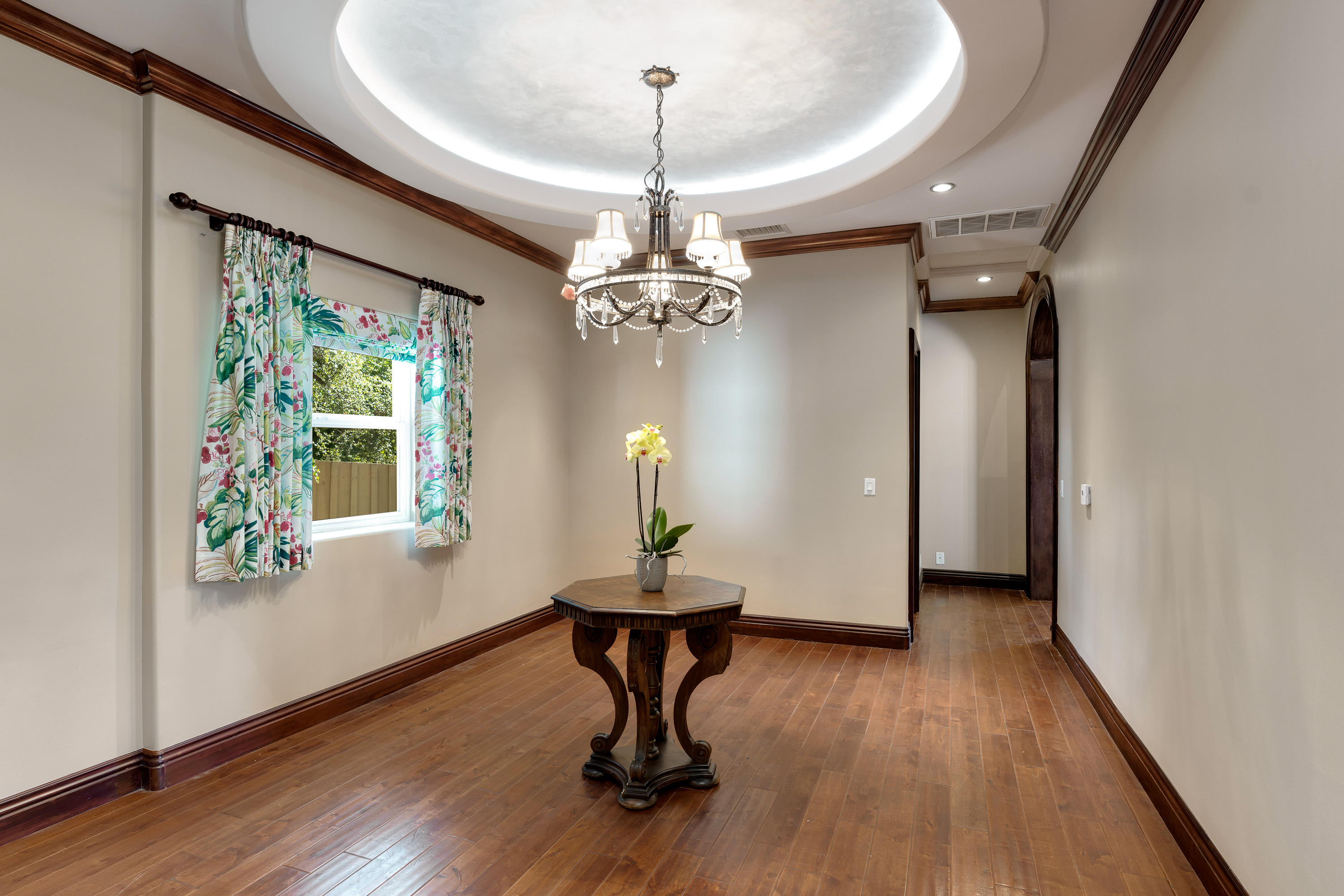 825 Chehalem Road La Canada Flintridge, CA 91011 - Photo 10 of 24 a dining room with wooden floor potted plant and a chandelier