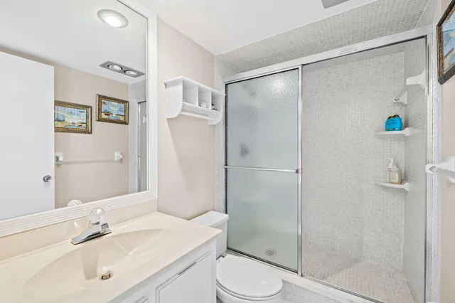 a bedroom with a bed and a lamp